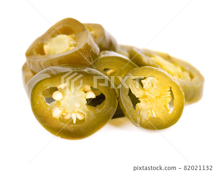 Pickled jalapeno pepper isolated on white background. Slices of preserved hot serrano. 82021132