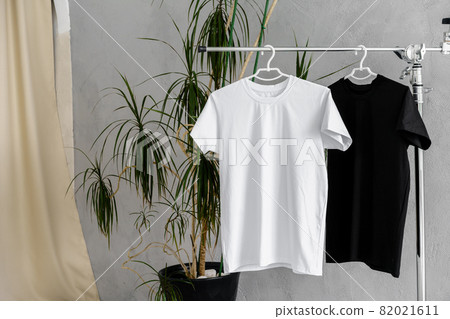 White and black T-shirts on hangers for design presentation White and black T-shirts on hangers for design presentation 82021611
