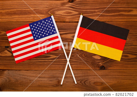 Flag of USA and flag of Germany crossed with each other. USA vs Germany. The image illustrates the relationship between countries. Photography for video news on TV and articles on the Internet and med 82021702