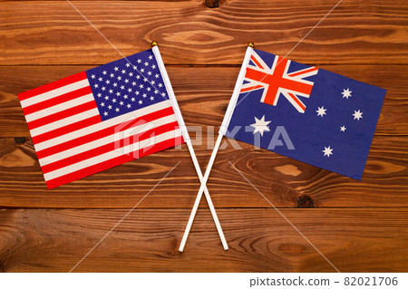 Flag of USA and flag of Australia crossed with each other. USA vs Australia. The image illustrates the relationship between countries. Photography for video news on TV and articles on the Internet and Flag of USA and flag of Australia crossed with each other. USA vs Australia. The image illustrates the relationship between countries. Photography for video news on TV and articles on the Internet and 82021706