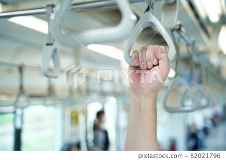 Male hand grabbing a strap 82021796