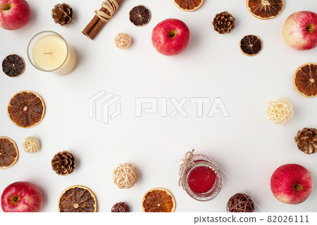 Autumn flat lay composition of apples, fall foods and decor on white background. Ingredients for jam or mulled wine. Autumn or winter holiday food concept. Creative trendy flat lay with place for text Autumn flat lay composition of apples, fall foods and decor on white background. Ingredients for jam or mulled wine. Autumn or winter holiday food concept. Creative trendy flat lay with place for text 82026111