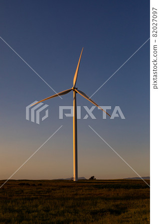 General view of wind turbine in countryside landscape during sunset General view of wind turbine in countryside landscape during sunset 82027097