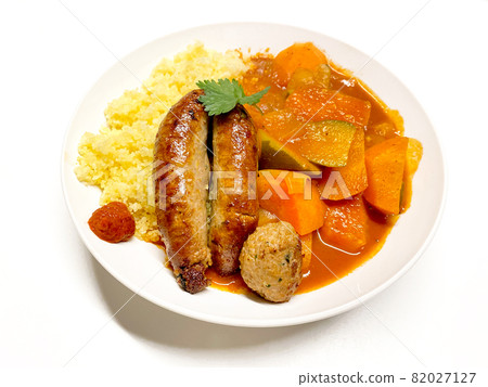 Couscous eaten with homemade sausage and tomato sauce Couscous eaten with homemade sausage and tomato sauce 82027127