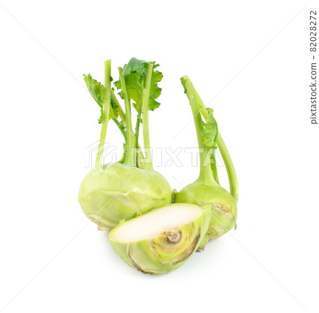 Fresh kohlrabi with green leaves on isolated white background Fresh kohlrabi with green leaves on isolated white background 82028272