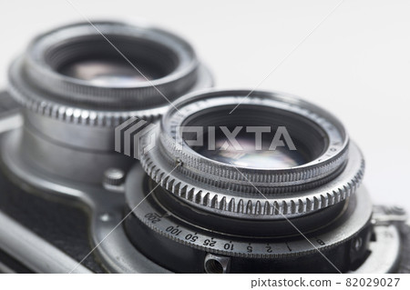 Close up of Vintage camera two lenses on white background. Close up of Vintage camera two lenses on white background. 82029027