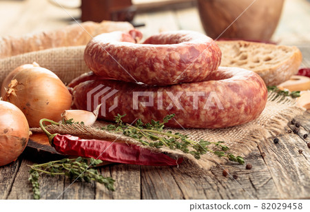 Dry-cured sausages with herbs and spices. 82029458