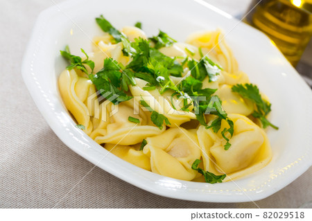 Delicious appetizing dumplings with parsley Delicious appetizing dumplings with parsley 82029518