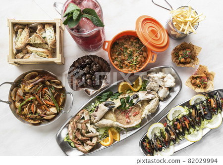 mixed spanish gourmet tapas sharing set selection on restaurant table mixed spanish gourmet tapas sharing set selection on restaurant table 82029994
