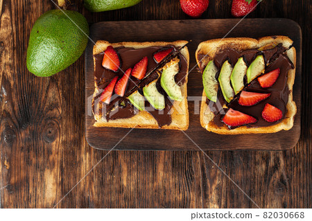 French toasts with peanut butter and fruit pieces French toasts with peanut butter and fruit pieces 82030668