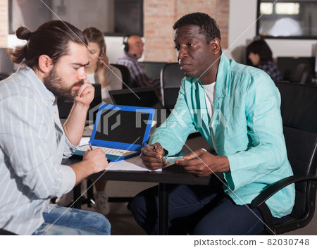 Multiracial partners talking Multiracial partners talking 82030748