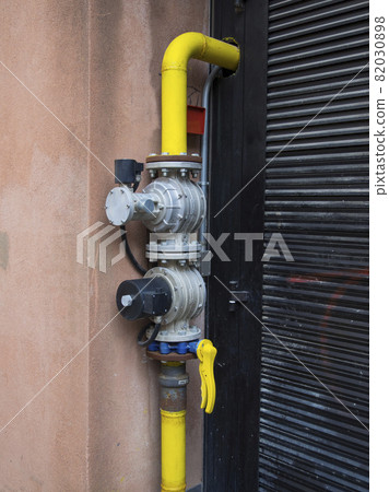 pipes and  safety valves supply natural gas to a building 82030898