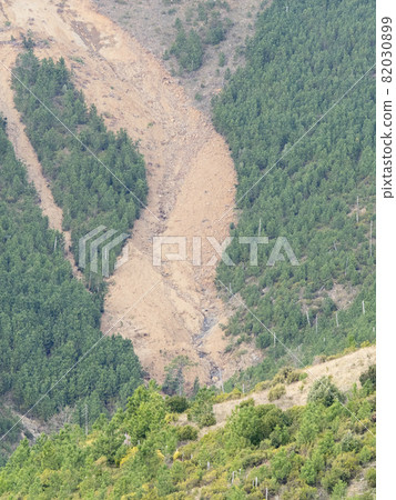 big landslide on the side of a mountain: soil erosion big landslide on the side of a mountain: soil erosion 82030899