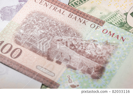 Close up to 100 Baisa of the Arabic country oman. Paper banknotes of the Arabian country. Detailed capture of the reverse art design. Detailed money background wallpaper. Currency bank note 82033116