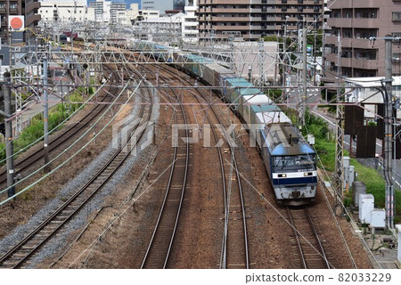 A long freight train that goes on the Tokaido Main Line A long freight train that goes on the Tokaido Main Line 82033229