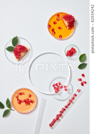 Cosmetic laboratory concept. Preparation of pomegranate essence or organic extract from pomegranate and leaves. 82034242