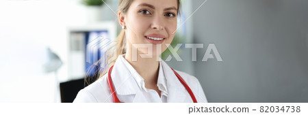 Portrait of beautiful young woman medic in clinic Portrait of beautiful young woman medic in clinic 82034738