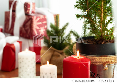 Interior decoration with red and white Christmas candles Interior decoration with red and white Christmas candles 82035143