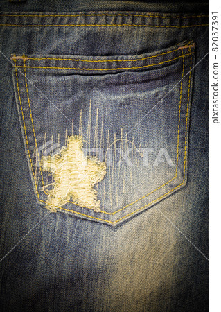 Vintage jeans torn denim texture. Vintage jeans torn denim texture. 82037391