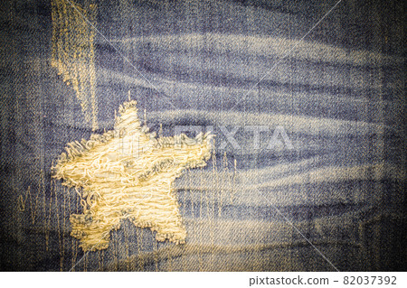 Vintage jeans torn denim texture. Vintage jeans torn denim texture. 82037392