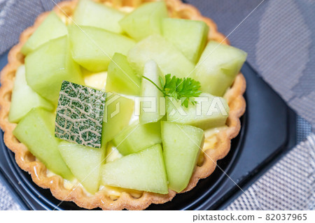 A photo of a delicious melon tart cake 82037965