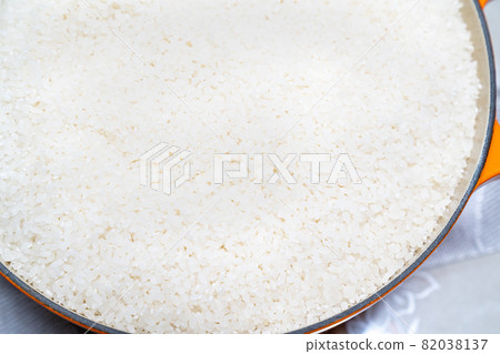 A photo of white rice before cooking. 82038137