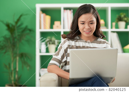 Young Woman Programming on Laptop 82040125