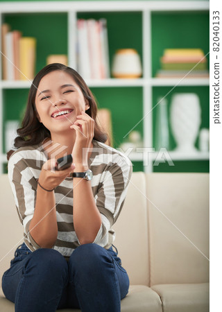 Laughing Woman Watching Comedy Movie 82040133
