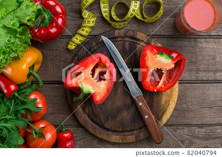 Glass of tomato juice with vegetables and measuring tape on table close-up Glass of tomato juice with vegetables and measuring tape on table close-up 82040794