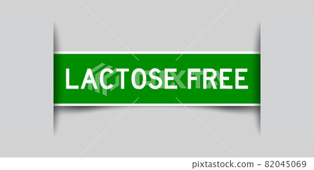 Inserted green color label sticker with word lactose free on gray background 82045069
