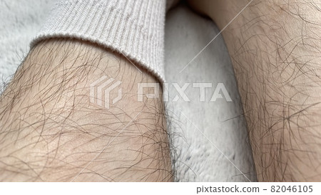 Female shin in white socks with lots of unwanted hair Female shin in white socks with lots of unwanted hair 82046105