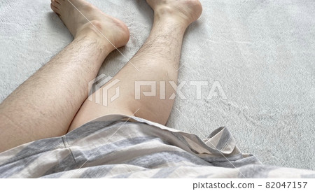 Women's shins and calves with lots of unwanted hair 82047157