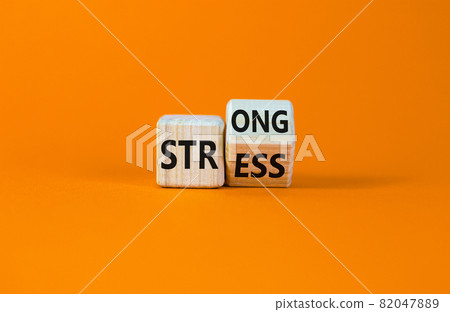 Strong stress symbol. Turned wooden cubes with words 'strong stress'. Beautiful orange background, copy space. Business and strong stress concept. Strong stress symbol. Turned wooden cubes with words 'strong stress'. Beautiful orange background, copy space. Business and strong stress concept. 82047889