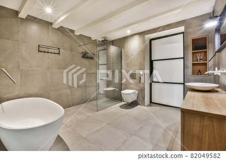 Bright and stylish bathroom with luxury bathtub Bright and stylish bathroom with luxury bathtub 82049582