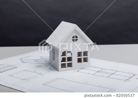 Model of house on drawing. Building and architect concept Model of house on drawing. Building and architect concept 82050537