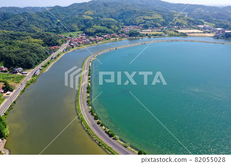 Aerial view of Mihoseki Yatsuka Matsue Line running over the sea of Nakaumi 82055028