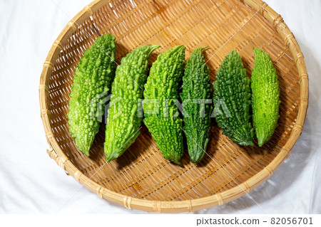 Freshly picked bitter gourd on a colander harvested in the vegetable garden 82056701