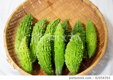 Freshly picked bitter gourd on a colander harvested in the vegetable garden 82056703