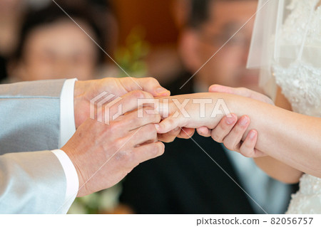 Wedding scene exchange of wedding rings 82056757