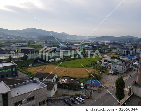 Construction. Development site. City. Building. Morning. Mountain. 82056844