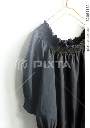 Black blouse shoulder and sleeve gathers and light and copy space Black blouse shoulder and sleeve gathers and light and copy space 82061181