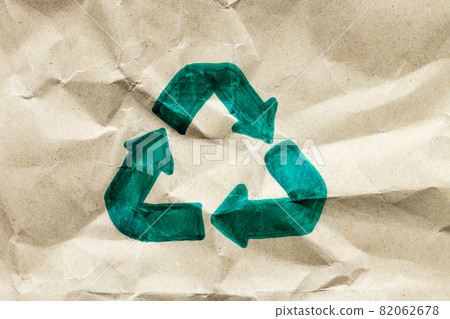 Green recycle symbol on paper cardboard background, Eco friendly and sustainability concept 82062678