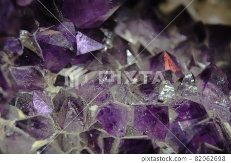 Close up of the pattern and texture of raw uncut blue sapphire gemstones 82062698