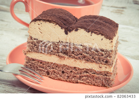 Tasty tiramisu cake and black coffee for different occasions. Delicious dessert Tasty tiramisu cake and black coffee for different occasions. Delicious dessert 82063433