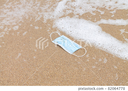 Used protective face mask in sea and plastic pollution concept Used protective face mask in sea and plastic pollution concept 82064778