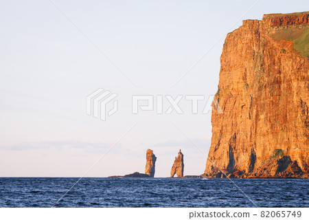 Risin and Kellingin sea stacks at sunset on Faroe Islands 82065749