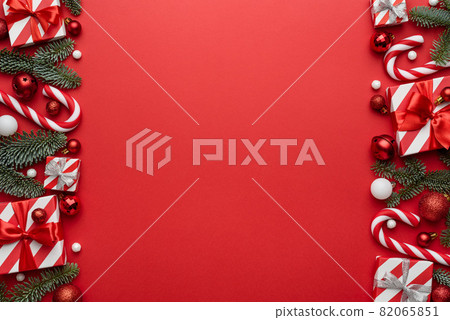 Christmas and New Year background with fir decorations on red background 82065851