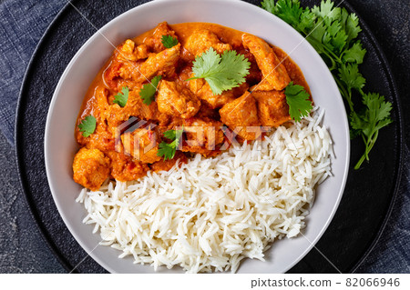 butter chicken, curry of spicy chicken with rice 82066946