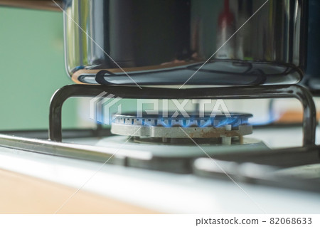 Peparing food on gas at home. Gas burner for a large pan. Peparing food on gas at home. Gas burner for a large pan. 82068633