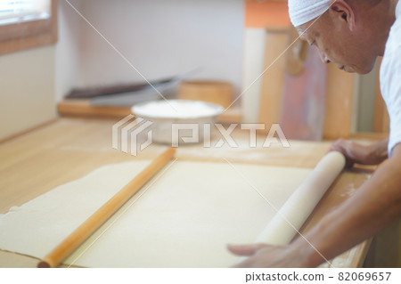 Man hitting buckwheat Man hitting buckwheat 82069657